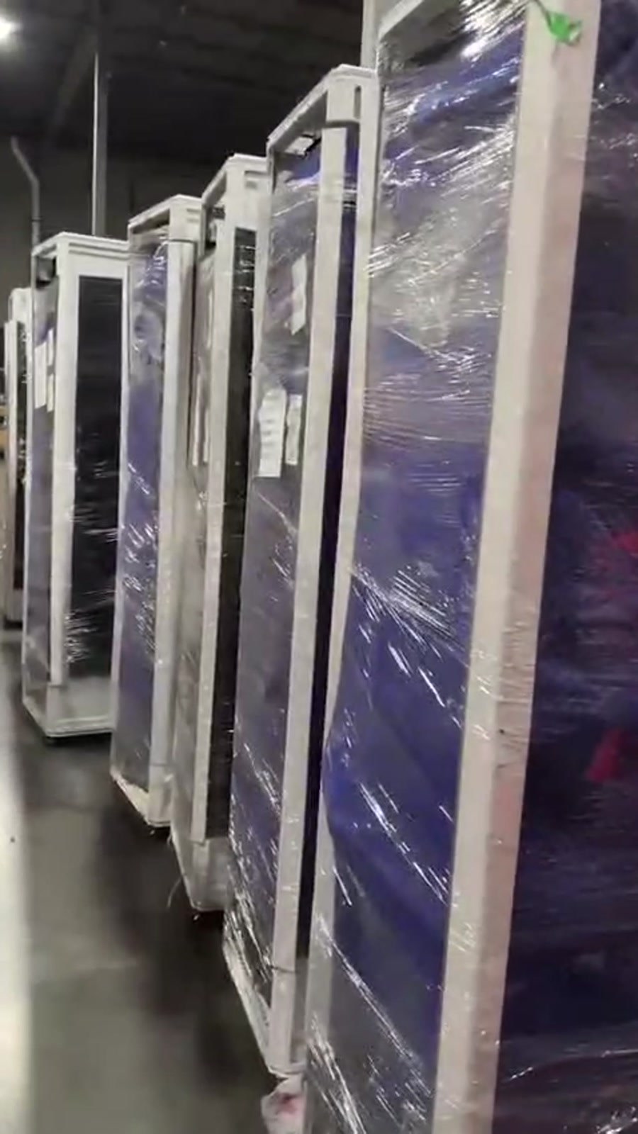 Row of wrapped rack cabinets in the supplied hardware video